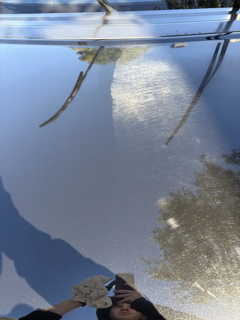 Range Rover hood swirl marks under sun before paint correction